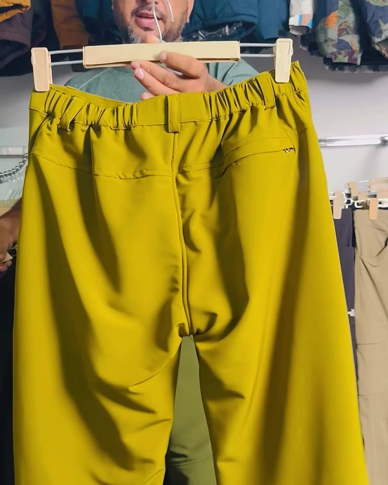Mustard fleece lower held up on a hanger showing the elastic waist