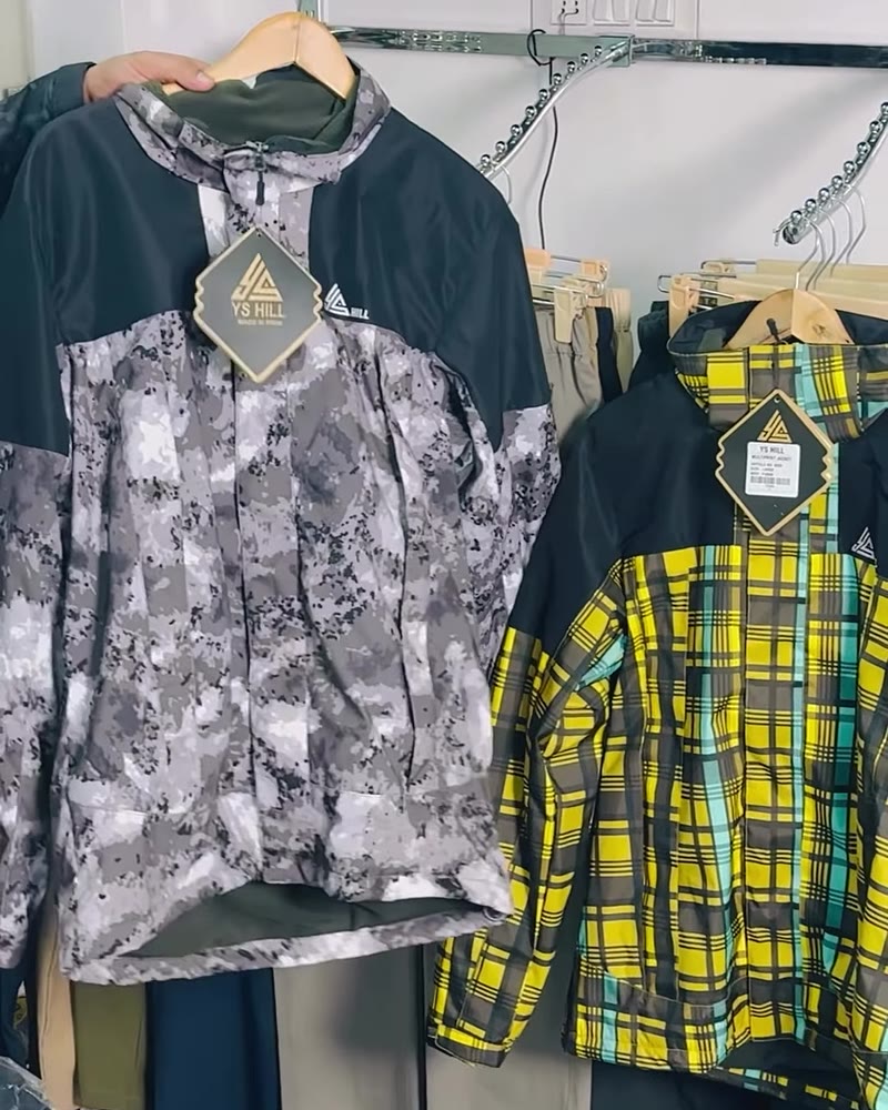 Rack of printed and plaid YS Hill shell jackets